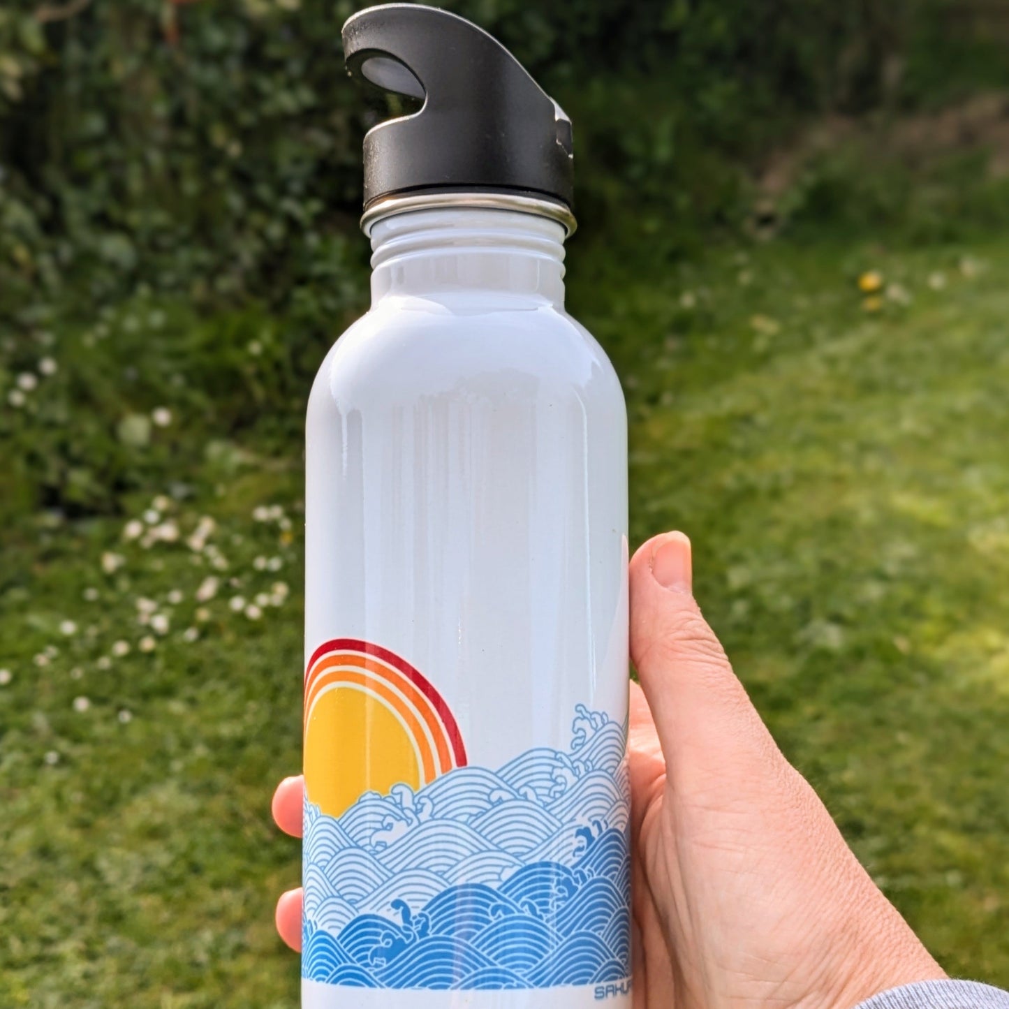 "Sunsets and Sea dips" Water bottle